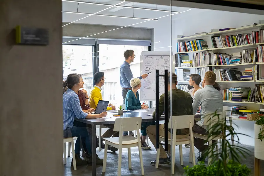 A group of people having a meeting in an office