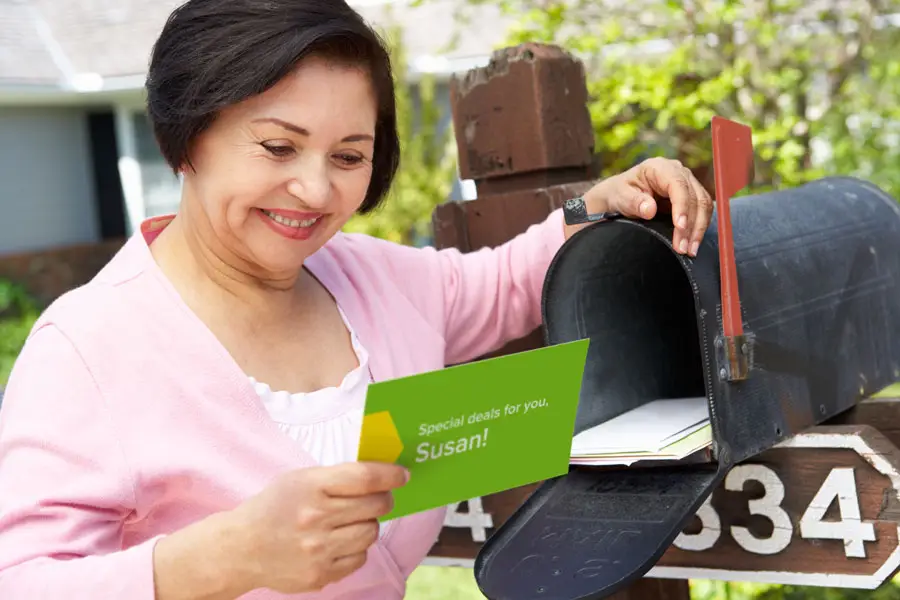 A woman receiving a personalized mailer