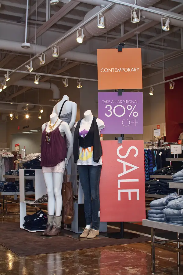 A sign advertising a sale in a retail store